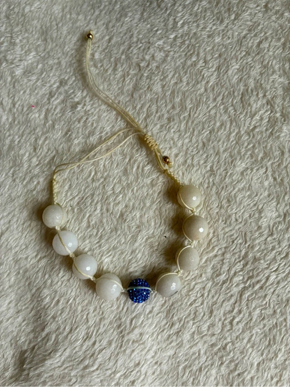 Adjustable White Bead Bracelet with Blue Accent